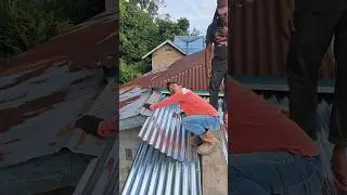 The building foreman doesn't understand how to properly install a tin roof
