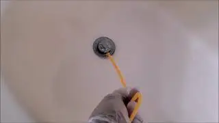 How to quickly unclog a bathtub drain pipe without calling a plumber