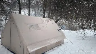 Our snow camp with our inflatable tent in a place like the land of snow.