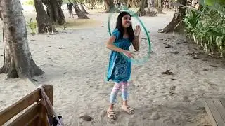 Playing hula hoop in lio beach