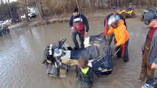 my little buddy turns over Polaris in water hole at River Run