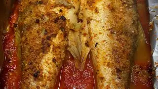 Oven-baked fish in foil. Marinade: orange juice, garlic, olive oil, spices, and salt.