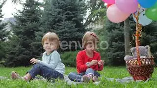 Two Little Girls with Balloons in the Park | Stock Footage - Envato elements