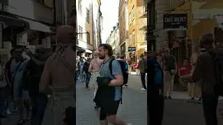 Tourists dance with Hare Krishnas in Stockholm