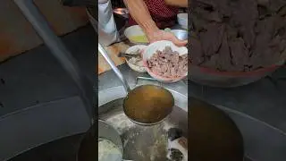 Boiling meat like this is just the right amount of doneness at a noodle shop Chiang Mai, Thailand.