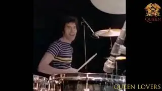 Freddie Mercury playing drums ~ Roger Taylor playing guitar
