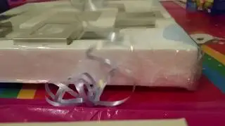 Fotouhr mit Geschenkfolie verpacken