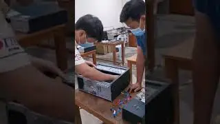 PLT Computer System Engineering student is demonstrating how to disassemble a computer