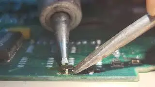 Soldering a small outline transistor.