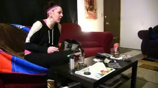Nikki smoking on the couch