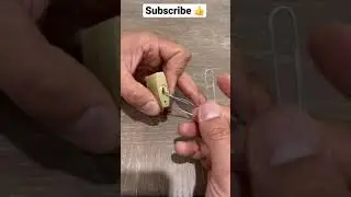 Pick open a lock with a paper clip 