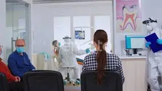 Dental Nurse with Protection Suit and Clipboard Leaving Reception | Stock Footage - Envato elements