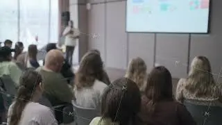 Audience listening to a speaker in a conference or seminar room