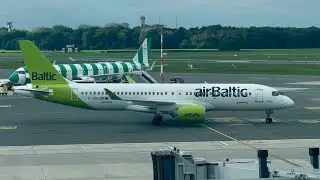 Air Baltic Airbus A220-300 taking off from Hamburg Germany