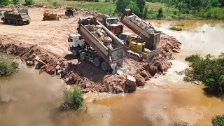 Perfectly Technique Of KOMATSU DOZERS Push Most Stones Filling Up Flooded Area With Dump Trucks Team