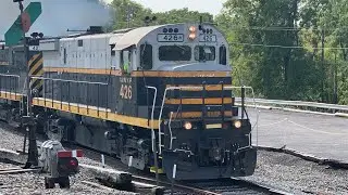 WNY&P Alco unit leading a LA&L 6 car train through industry