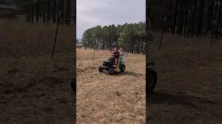 learning to drive on a lawnmower.