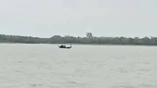 small boat in river