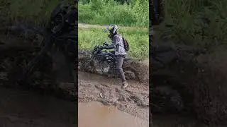 Red Bull Russian man  on a Chinese bike covered in mud