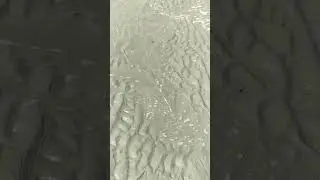 Water Flowing Over Sand