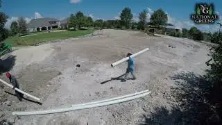 Installing drainage behing the synthetic golf enviroment and attaching bunker drains to main line.