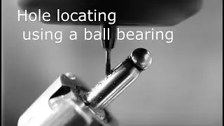 Hole locating using a ball bearing