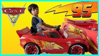 Joey playing with Lightning McQueen ride on at the playground