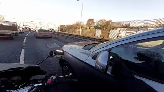 Dozy woman driver shunts bike is not even aware of it...!!!