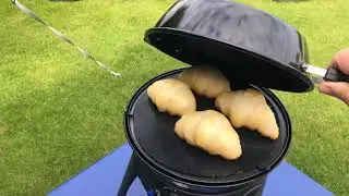 Cooking fresh croissants on a Cadac Safari Chef 2 on a camp site.