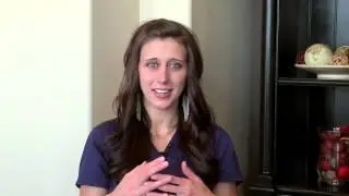 How can I keep milk from coming out of my baby's nose when she's full?