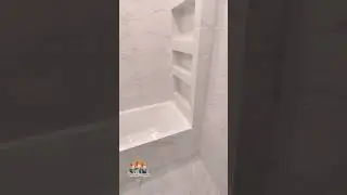 A niche with tiled shelves in the bathroom 