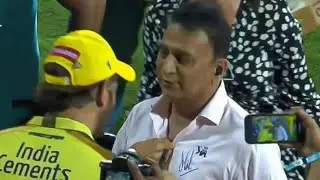 Ms Dhoni giving autograph to legend Sunil Gavaskar