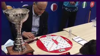 Owner QG Nadeem Omar plays a scrabble match with World Champion Imaad Ali