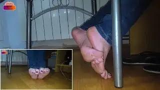Gorgeous bare feet in jeans under chair