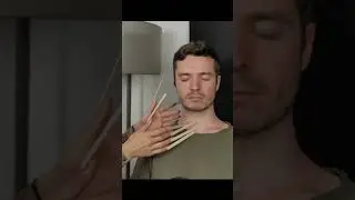 Extremely long wooden fingernails inspect his head 