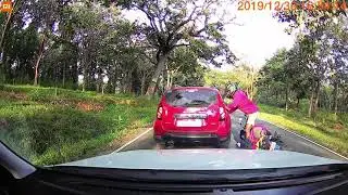 Wild Elephants about to attack the Bike rider. Bike rider nearly saved his life.