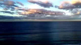Orange Clouds and Dark Blue Ocean