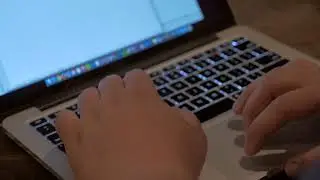 Hands typing on Macbook keyboard in 4K | Free stock Mac video