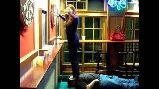 Pete Tino, The Human Floor, Shea Chugging a Beer, while Standing on My Face, at Trinity Bar.