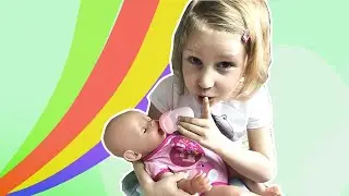 Milana's like mom. Milana takes care of her Baby Born doll.