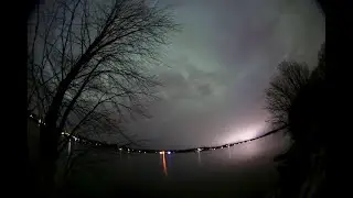 Timelapse of Aurora Borealis (Northern Lights) behind clouds at Elk Lake, Minnesota