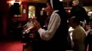 Dancing nun in O'Donoghue's Pub; Killarney, Ireland