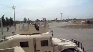 Apache helicopter firing on a house in Balad, Iraq.