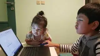 Baby girl eating Mouse