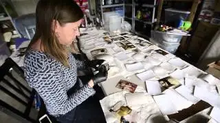 Group works to clean flood damaged family photos