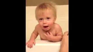 Daddy and Baby singing together in bathtub
