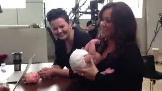 Fake Baby Bryce gets a wrap by Mama Sue Bryce & Susan Roderick with Kelly Brown