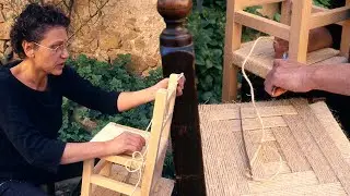 Hand-stringing chairs with natural ropes. Traditional restoration of antique chairs