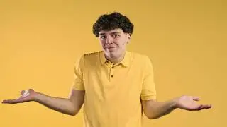 Confused man, shoulders up   can't help, makes gesture of I dont know  Difficult question, guilty re