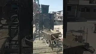 Storing Concrete In Large Tank & Pouring From Tank Into Wheelbarrow For Lintel Construction